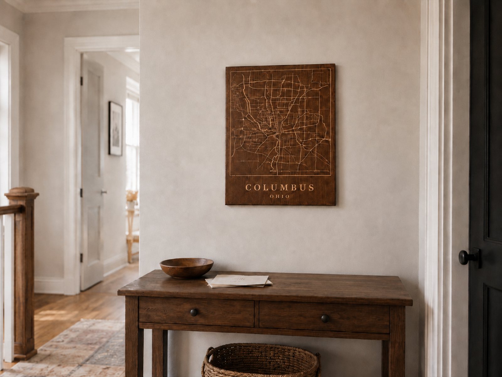 Engraved walnut Columbus, Ohio street map hung in a hallway