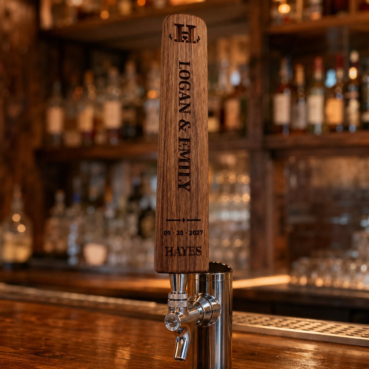 Engraved oak beer tap handle personalized with a couple's names and wedding date, mounted on a kegerator at a bar